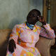 african woman sitting in a fashionable dress